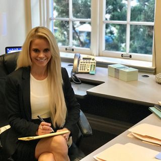 team member sitting at her desk