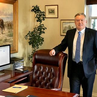 Stephen B. Morris posing in his office